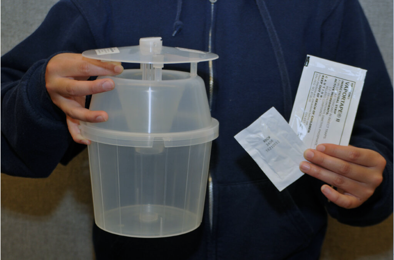 Moth trapping supplies: a bucket trap, pheromone and a kill strip. All available from Great Lakes IPM.
