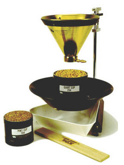 Fig. 1. A standard filling hopper and stand for the accurate filling of quart or pint cups for grain test weight determination. (Image: http://www.seedburo.com). 
     