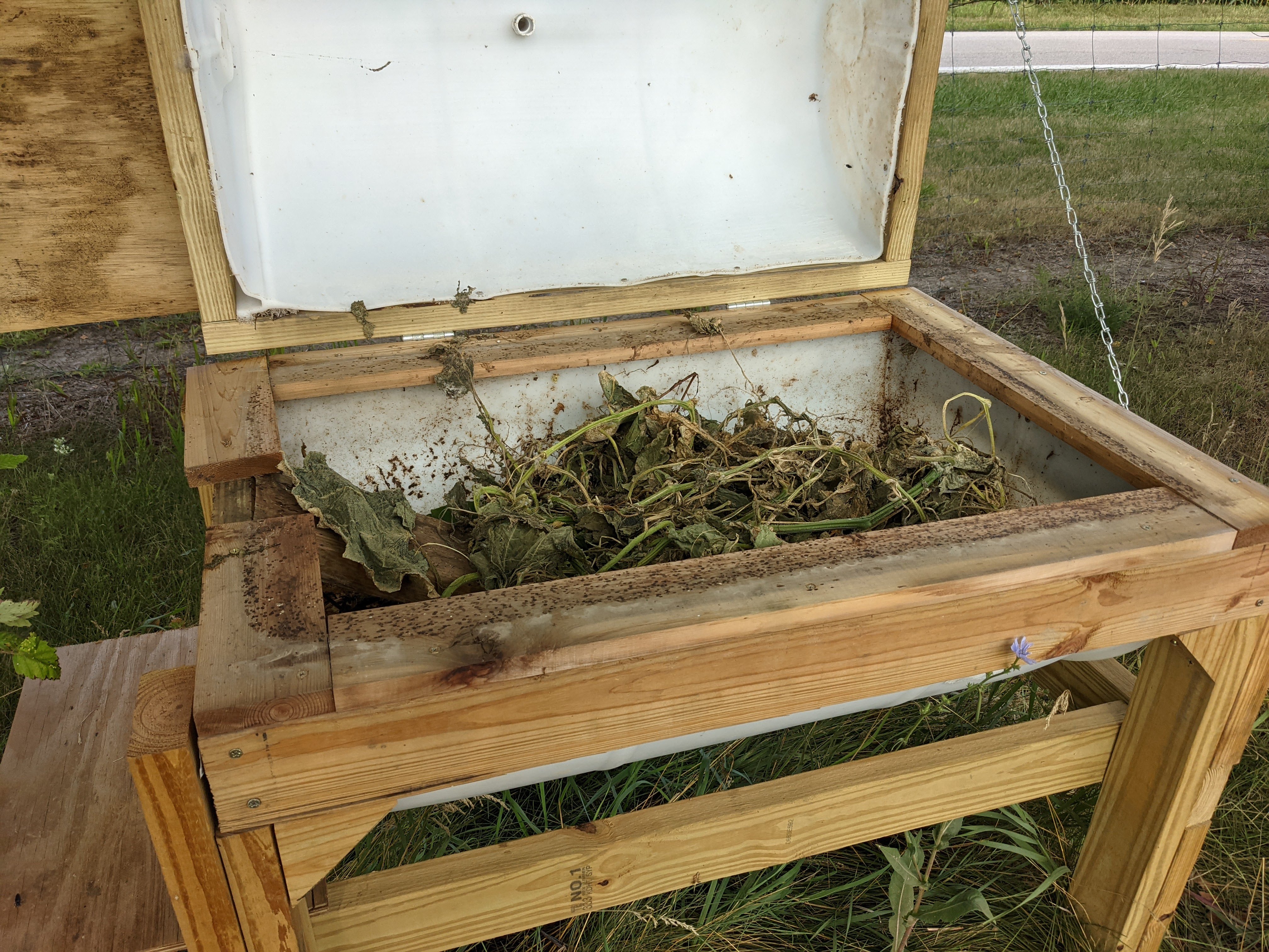 Figure 23. Inside of bin, mounted to legs and lined with 1x4 cut lumber. (<em>Photo credit: Catherine Terrell</em>)